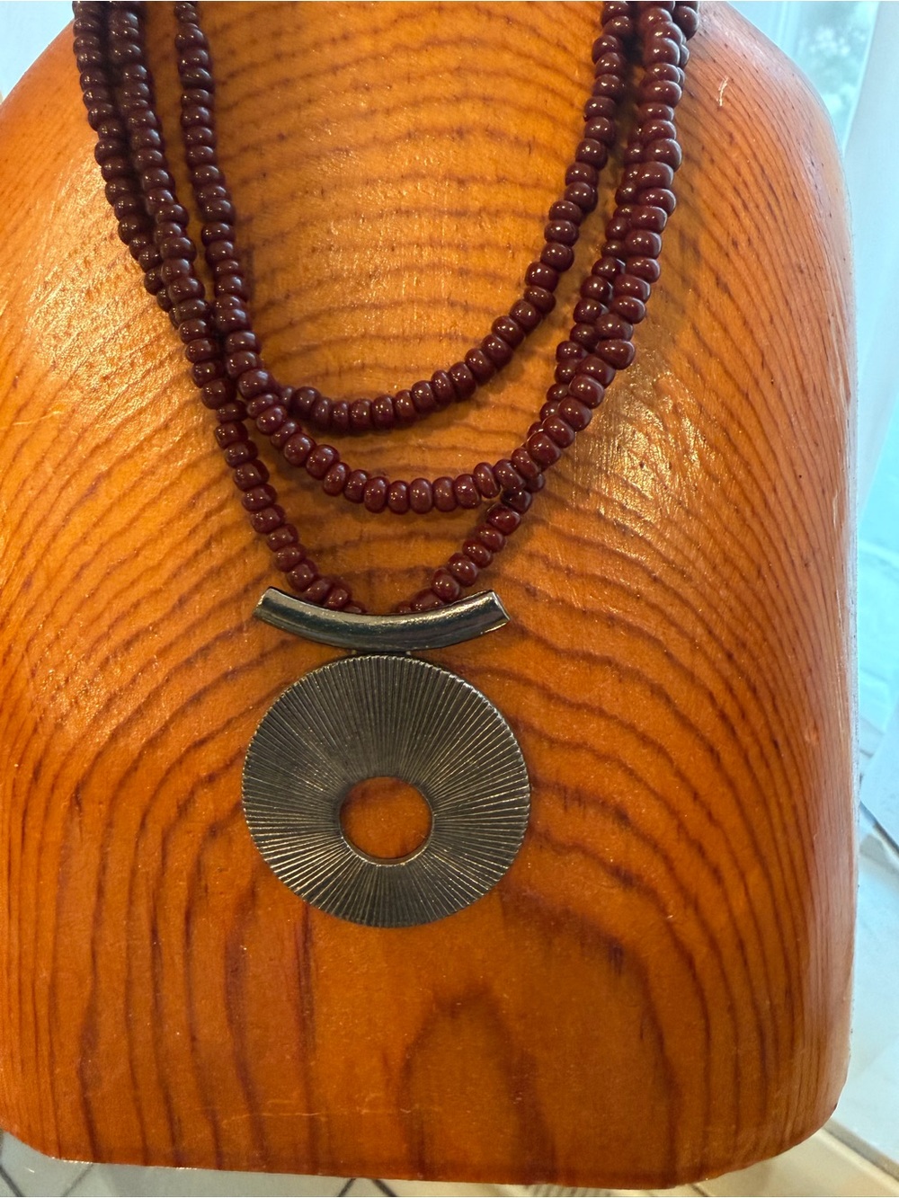 Multi-Strand Maroon Beaded Necklace with Silver Disc Pendant